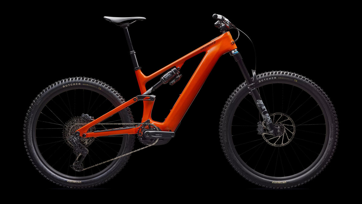 Turbo Levo 4 Comp (2026) — Gloss Orange Tint Over Silver Dust / Dark Navy — side view