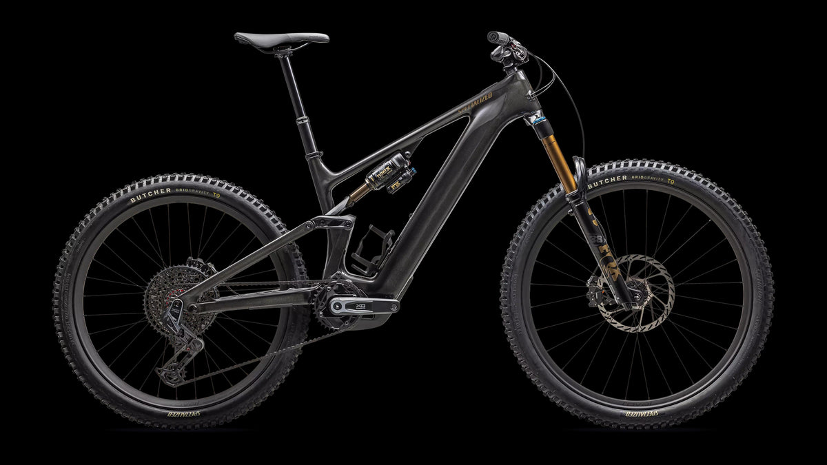 Turbo Levo 4 Pro (2026) — Gloss Metallic Obsidian / Burnt Gold Metallic — side view