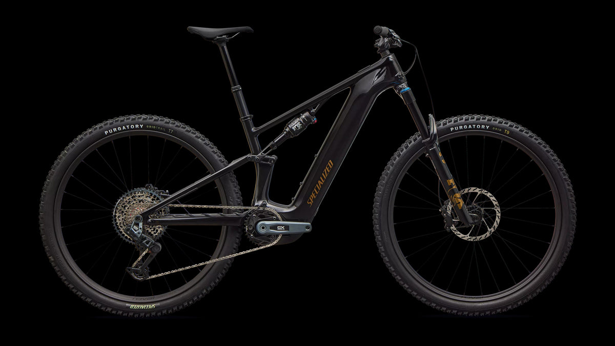 Turbo Levo R Expert (2026) — Gloss Carbon / Burnt Gold Metallic — side view