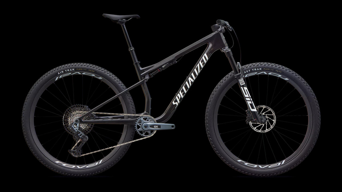 Epic 9 Expert (2027) — Gloss Carbon / White — side view